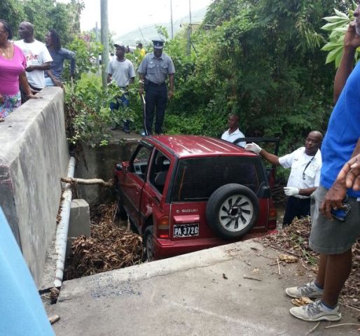Female driver becomes ill while driving and vehicle falls into an eight feet ghaut
