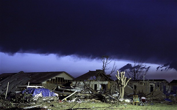 Emergency workers searched for survivors in the rubble of homes, schools and a hospital in Oklahoma after it was hit by a tornado, as officials lowered the death toll to 24.
