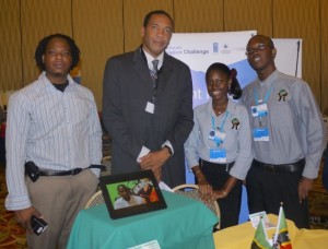 Senior Youth Officer Pierre Liburd (left) and Minister Phillip with two members of SKBC