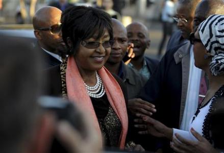 South Africa’s Mandela ‘improving’ as Obama flies in