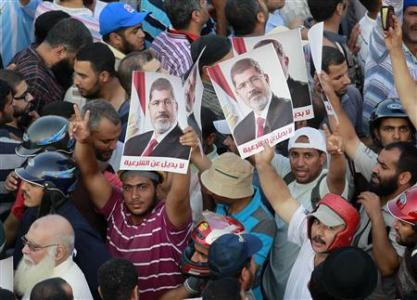 Egypt looks forward to new elections, back to week of bloodshed