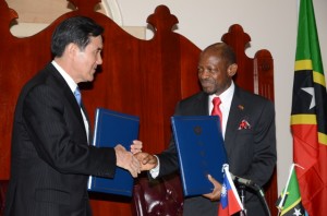 Prime Minister, the Rt. Hon. Dr. Denzil L. Douglas (right) and His Excellency President Ma Ying-jeou shake hands after signing the communique