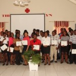  Participants of the 10th annual Summer Job Attachment Programme hosted by the Youth Affairs Division in the Ministry of Social Development showing off their Certificates of Completion at the close of the programme on August 23, 2013 