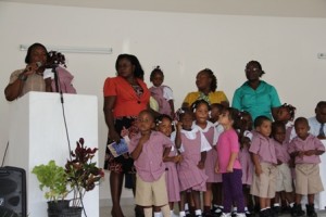 Staff and students of the first Combermere Pre School at the facility’s official opening on September 02, 2013 at Franklyn Browne Community Centre at Camps Village. Education Officer responsible for Early Childhood Education Mrs. Florence Smithen (second from left) assists with students