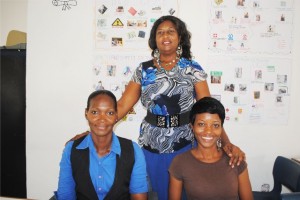 Senior students, Ms Arlene Rawlins (left) and Ms Keisha Henry (right) pose for a picture with Facilitator Averil Archibald. 