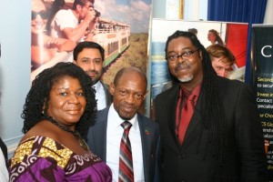  Two business leaders pose with St. Kitts and Nevis' Prime Minister the Rt. Hon. Dr. Denzil L. Douglas. 