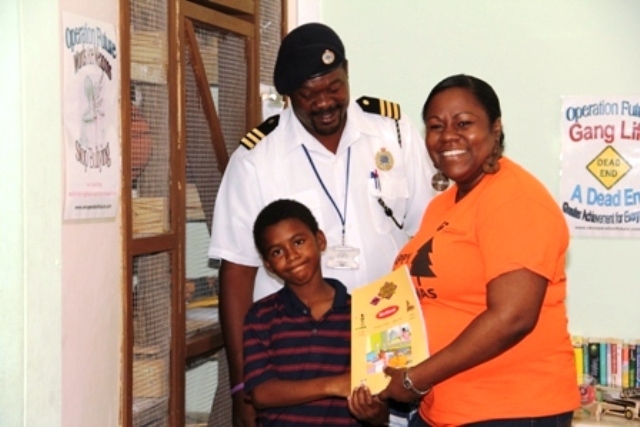 Caribbean Cable Communications donates books to Creative Youth Academy