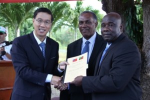 Signed documents handing the Republic of China/Taiwan’s Demonstration Farm at Cades Bay to the Nevis Island Administration by (l-r) Republic of China/Taiwan’s Resident Ambassador to the Federation His Excellency Miguel Li-Jey Tsao to Premier of Nevis Hon. Vance Amory and Minister of Agriculture on Nevis Hon. Alexis Jeffers on December 06, 2013