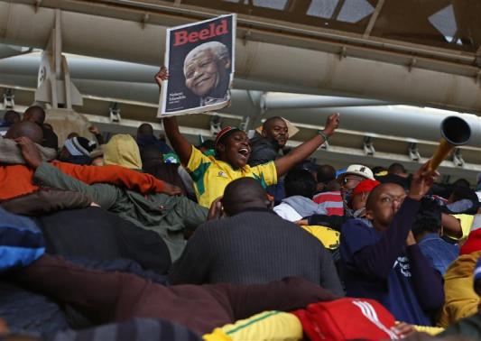 Leaders gather, thousands sing in rain in farewell to Mandela