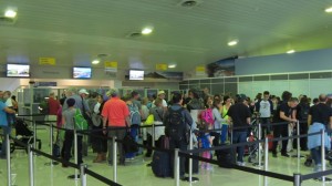 Air Canada passengers in the Arrivals Hall of the Robert L. Bradshaw International Airport o Monday. 