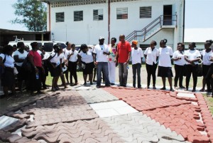 PEP Project Manager, Mr Geoffrey Hanley (7th from right,) with Women in Construction Trades trainees, a component of PEP, at All Solutions in CAP Industrial Site.