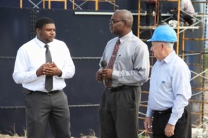 (L-R) Junior Minister responsible for Public Utilities Hon. Troy Liburd accompanied by Permanent Secretary Ernie Stapleton and Project Coordinator Brian Kennedy of the Caribbean Development Bank-funded Nevis Water Enhancement Project, visit Camps where the first reservoir is under construction 