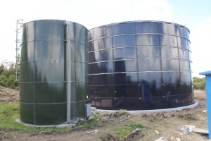 The completed water tank in the Caribbean Development Bank funded Water Enhancement Project, stands on the right of the existing water tank at Spring Hill. It is the second of six tanks to be erected. 