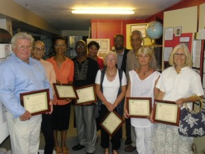 (L-R front) Awardees for long standing service to the Nevis Historical and Conservation Society Richard Lupinacci, Arthur Evelyn, Isabel Byron, Hanzel Manners, Jenny Lowery, Susan Gordon and Beverly Robinson. (Back row) Executive Director of the Nevis Historical and Conservation Society Evelyn Henville, Deputy Premier of Nevis and Minister of Culture Hon. Mark Brantley and Lloyd Hezekiah