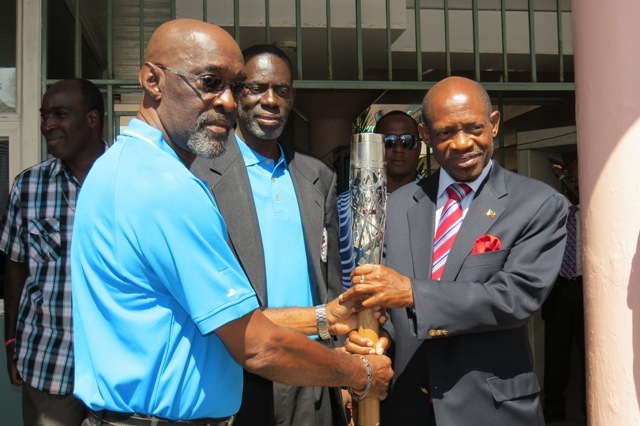 PM Douglas receives Queen’s baton on steps of Government Headquarters