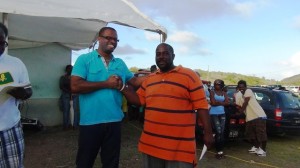 Arthur CABBAGE Farrell collects winnings from Hon Mark Brantley