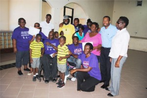Some of the course participants and officials of the St. Kitts Nevis Association of Persons with Disabilities pose for a group picture. Course facilitator Ms Lisa Hickson is standing on the right.