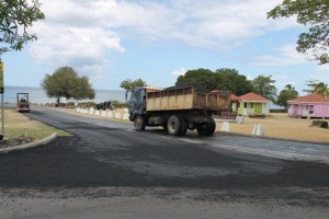 Locally owned trucks used to transport material for the resurfacing of the Samuel Hunkins Drive on April 04, 2014