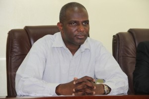 Terrance Crossman Chief Executive Officer of the St. Kitts and Nevis Sugar Industry Diversification Foundation at a handing over ceremony at the Ministry of Finance conference room on Nevis on June 24, 2014