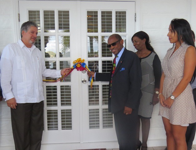 PM Douglas and Ambassador Gonzalez cut ribbon for the new Venezuelan Embassy