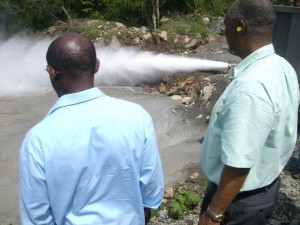 St. Kitts and Nevis' Prime Minister the Rt. Hon. Dr. Denzil L. Douglas (left) and then Premier of Nevis, the Hon. Joseph Parry looking at steam coming from a successful drill for geothermal in Nevis.