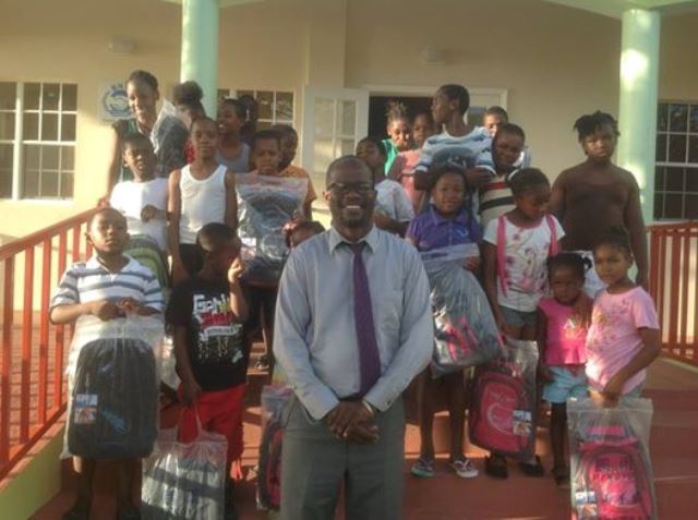 Hon. Nisbett to the rescue of many dismissed parents with gifts of school supplies