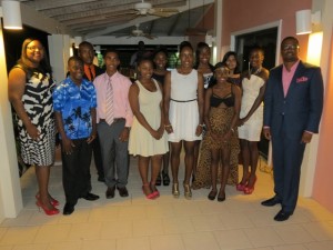 Coordinator of Youth Development Zahnela Claxton (extreme left) and Deputy Premier of Nevis and Senior Minister in the Ministry of Social Development Hon. Mark Brantley (extreme right) with some of the outstanding teenagers on Nevis recognised for their excellence, at a reception at the Mount Nevis Hotel on November 22, 2014.