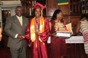 (L-R) Principal of the Nevis Sixth Form College and the Charlestown Secondary School Edson Elliott, Valedictorian of the 2014 graduating class of the College Chloe Williams and her mother Janet Parris at the Graduation ceremony at the Charlestown Methodist Church on November 12, 2014
