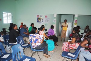  Ms Gloria Mills talking to the parents at the St. Johnston’s Community Centre.