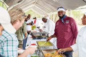 Chef Gregory and Chef D’Lashley serving patrons their mango inspired dishes at The Nevisian Mango Feast hosted by the Nevis Tourism Authority at Oualie Beach on July 12, 2015. Photo by Refined Digital Media 