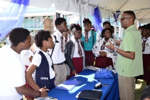 Students of the Verchilds High School gathers at one of the booths to learn more about the products and services offered