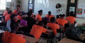 Danielle La Place, Executive Officer in the Department of Gender Affairs, presents to students at the Washington Archibald High School