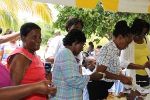 Seniors awaiting hot bread and butter at the Ministry of Tourism’s Nevisian Heritage Life at the Nevisian Heritage Village in Zion on May 05, 2016