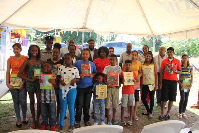 Cane Garden students receive second instalment from textbook initiative‏
