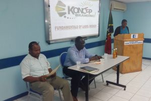Assistant Secretary in the Ministry of Agriculture, Ms Natasha Daniel, opening the Food Labelling Workshop. On the left is Mr Andy Blanchette of the Ministry of Agriculture, and next to him is Mr Augustine Merchant.