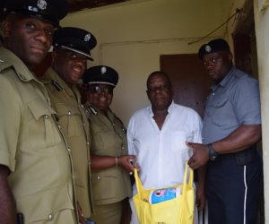 Mr Francis receiving gift from Police and Police Sports club