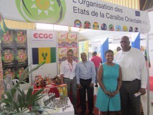 Saint Vincent and the Grenadines Ambassador to Cuba His Excellency Ellsworth I.A. John (right) and Minister Counsellor Mrs. Charmane Tappin-John (second from right), meet with representatives from the East Caribbean Group of Companies and other exhibiting firms.