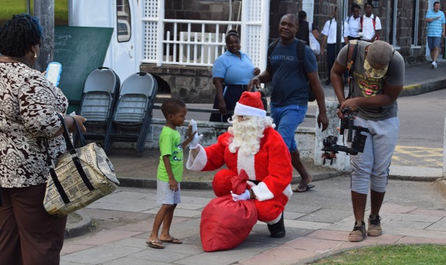 Santa and His Elves Spread Christmas Cheer At Independence Square