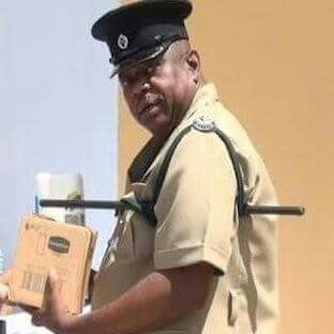 PRISON OFFICER DIES ON FERRY