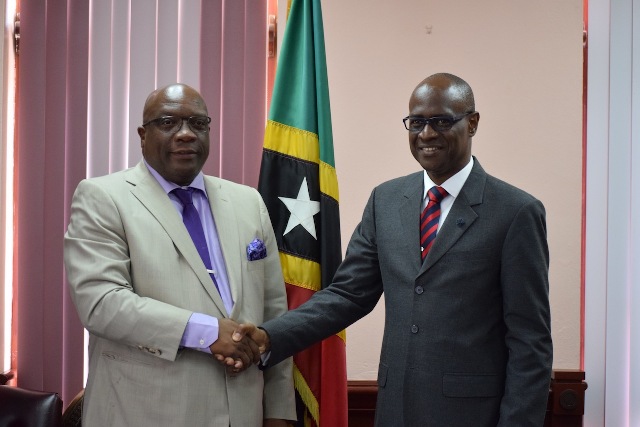 PM Harris Receives Courtesy Call from His Lordship Justice Trevor Ward, QC and Presents Him with Leading Law Books