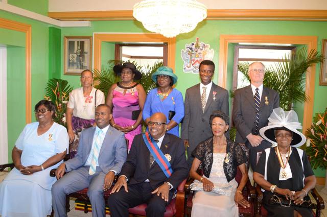 Eight Nationals Awarded At Government House for Contributions to Nation Building