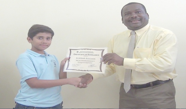 Top Student Receives Scholarship Award from the Ministry Of Social Development