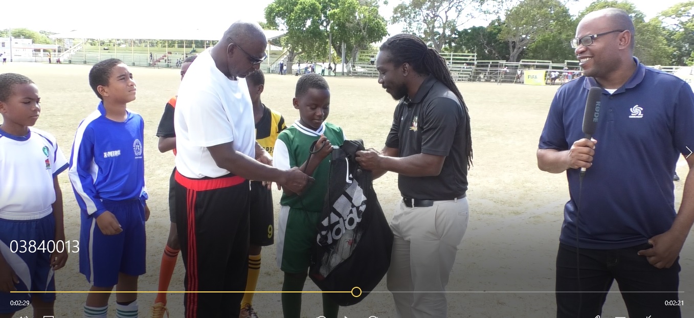 SKNFA Presents Football Gear To Schools On Nevis