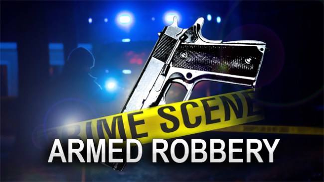 Armed gunmen rob Gingerland business; police officer shot