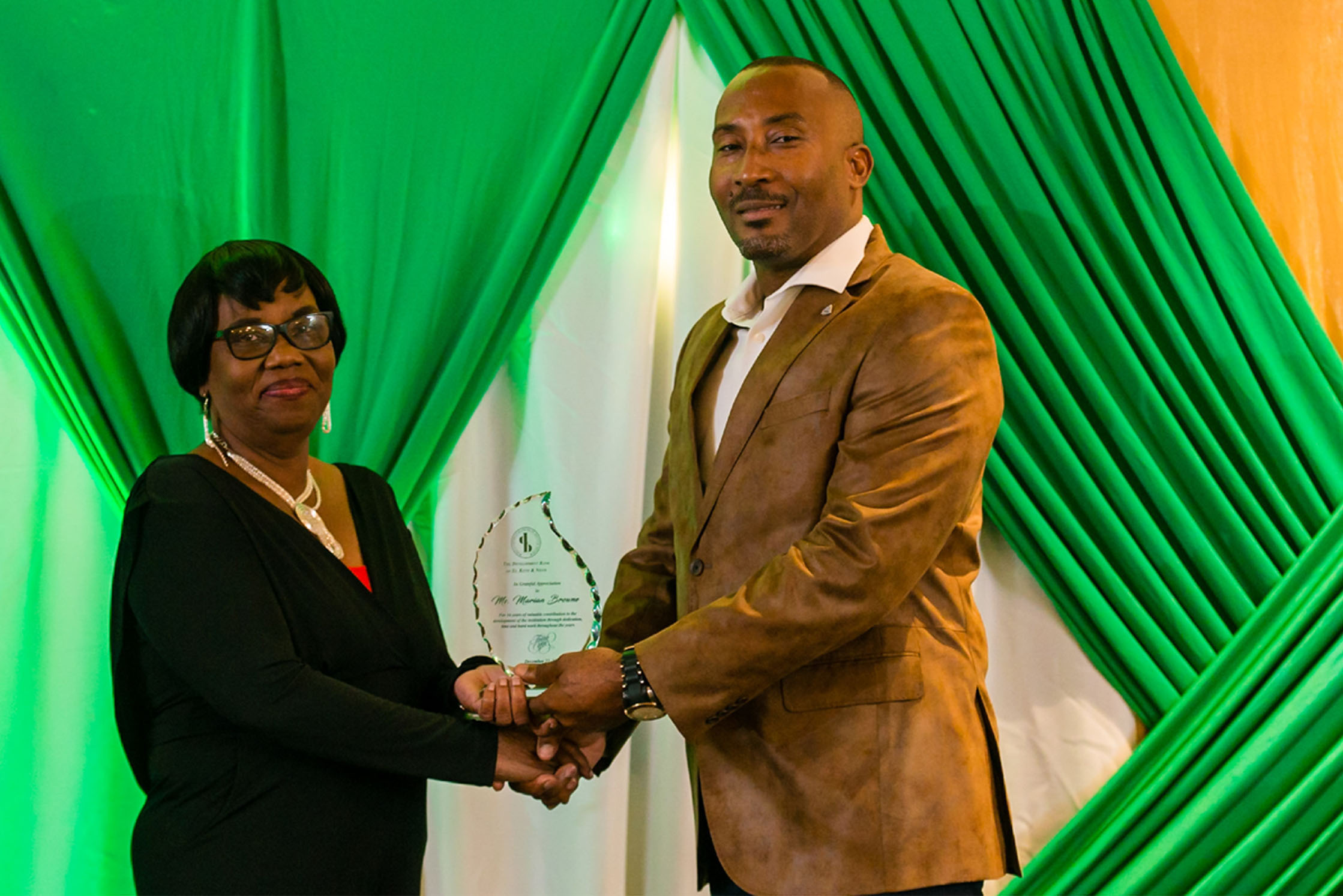 Development Bank bids farewell to two retiring dedicated staff members