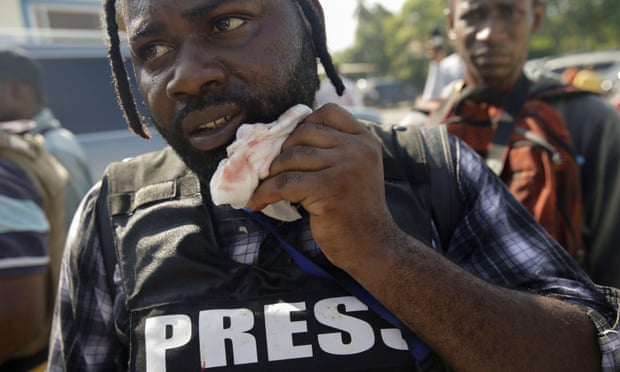 Haiti: photojournalist shot in face as senator opens fire outside parliament