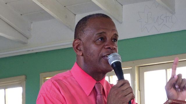 Hon. Eric Evelyn reminds GSS students of importance of the national anthem and their school song