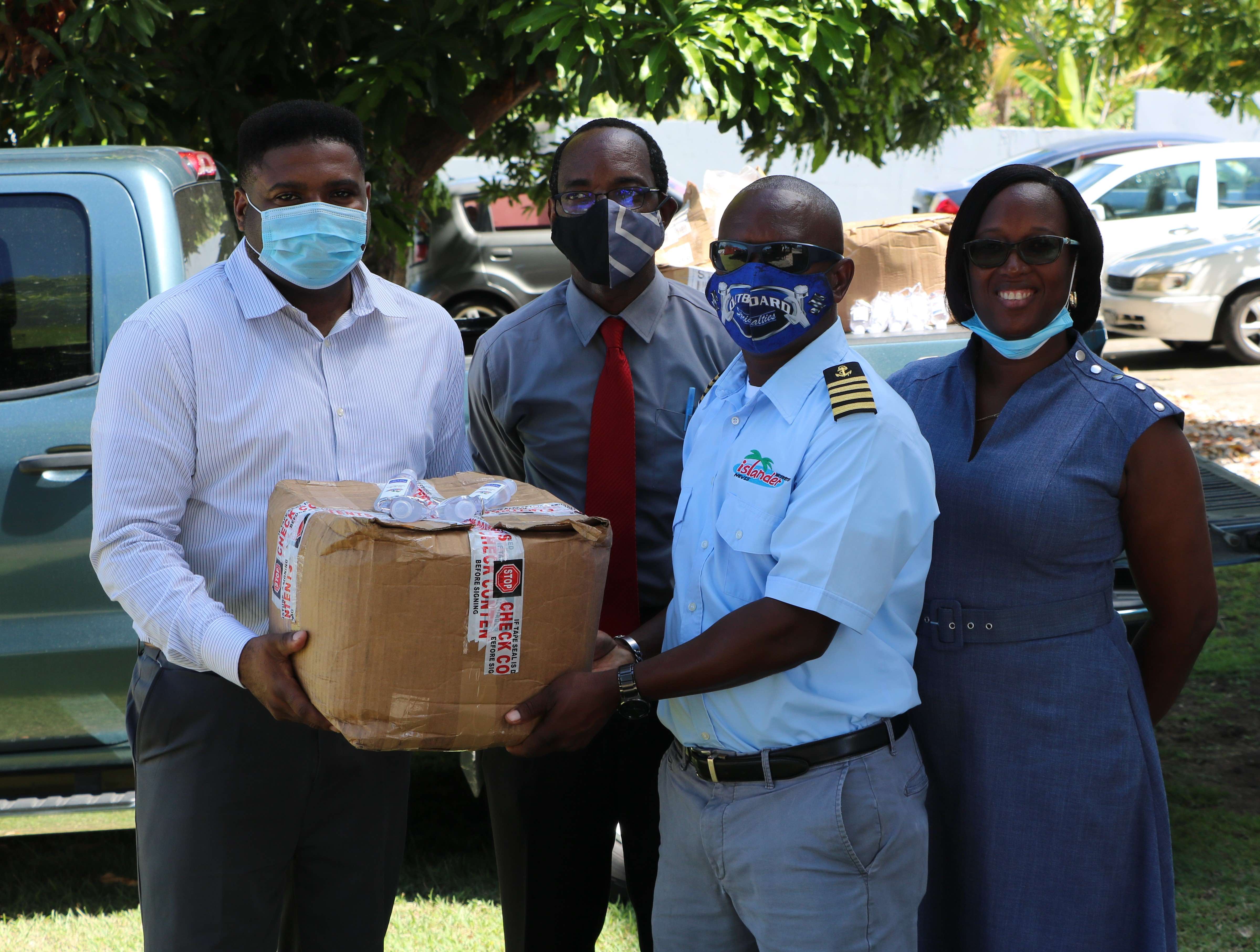 Islander Water Sports Donates Hand Sanitizers to Students on Nevis