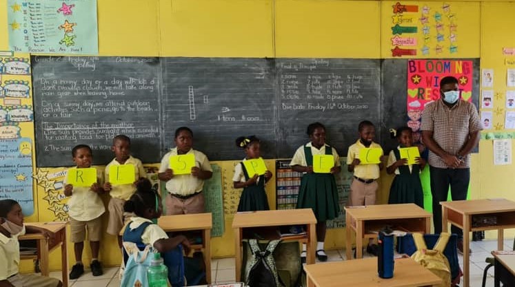 IWPS Grade 2-2 students receive gifts for winning Virtues Project