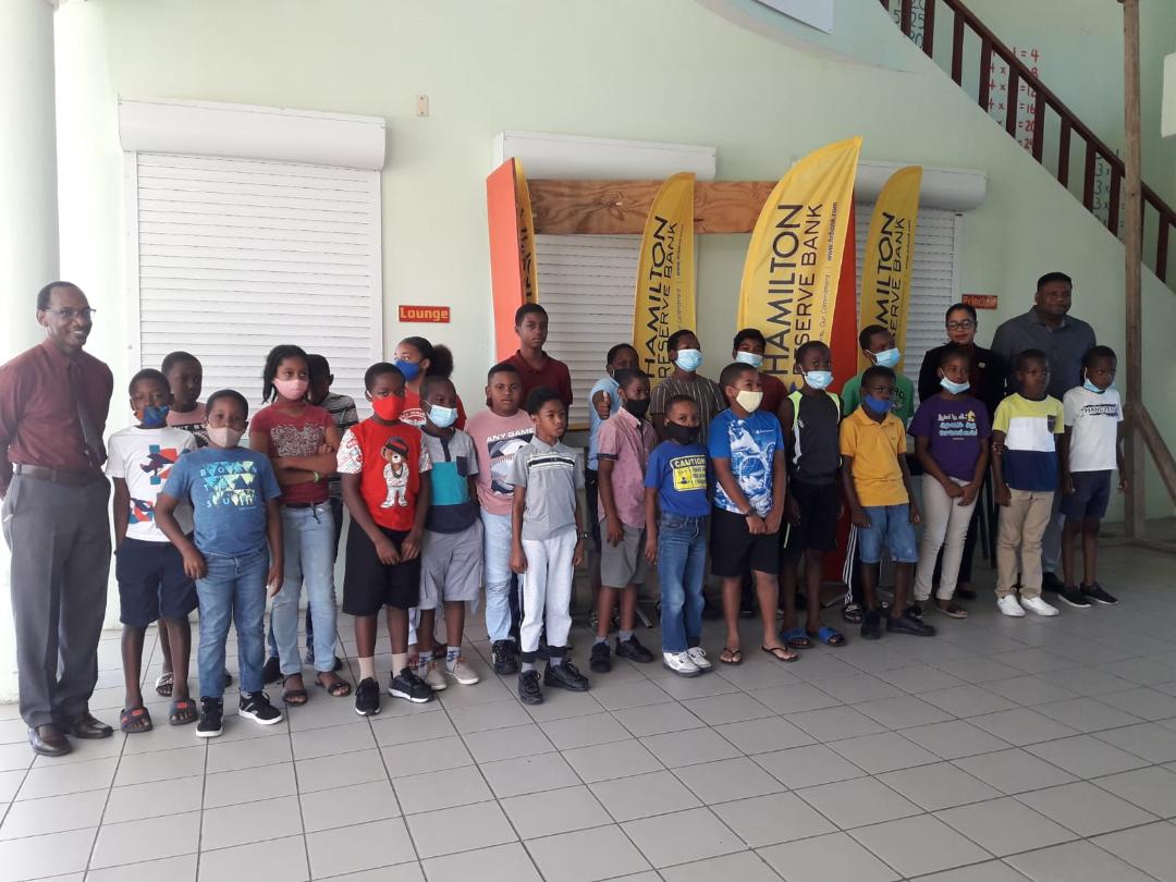 Public primary school students on Nevis participate in Kite Making Workshop